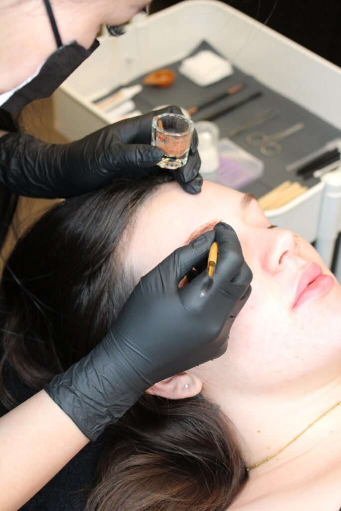 Professional brow tint service at NINETYFIVE Beauty in Winnipeg creating fuller, defined eyebrows.