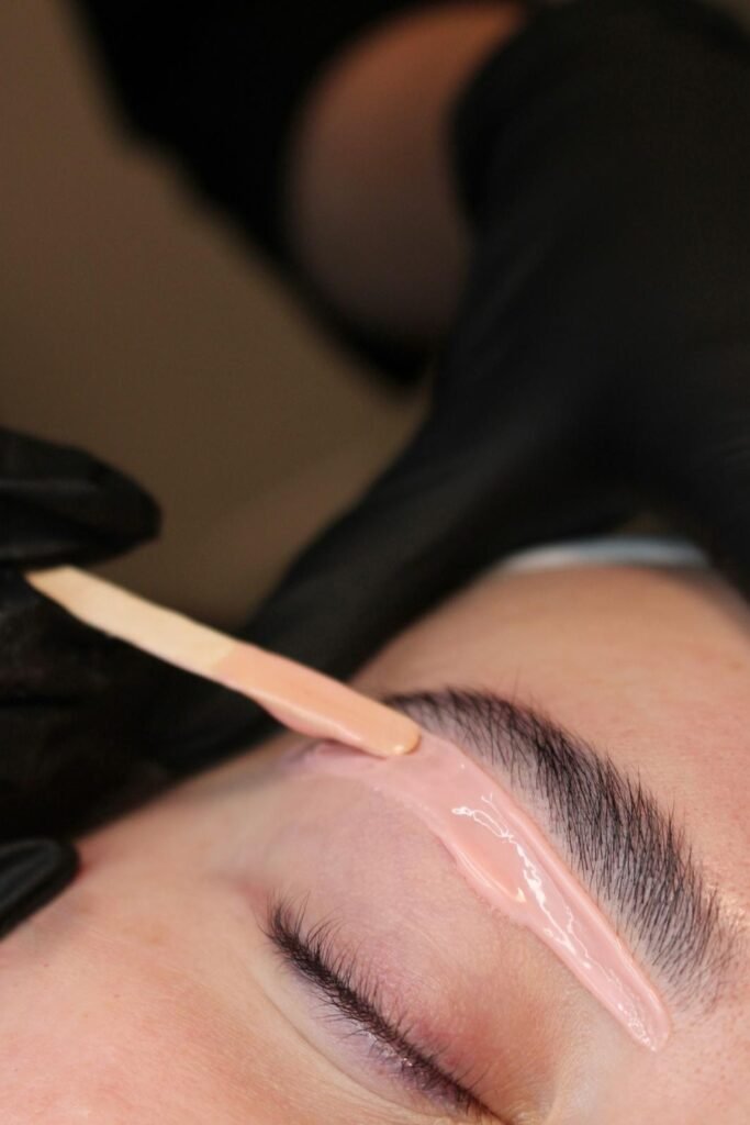 Professional eyebrow wax service at NINETYFIVE Beauty in Winnipeg creating clean, defined brows.